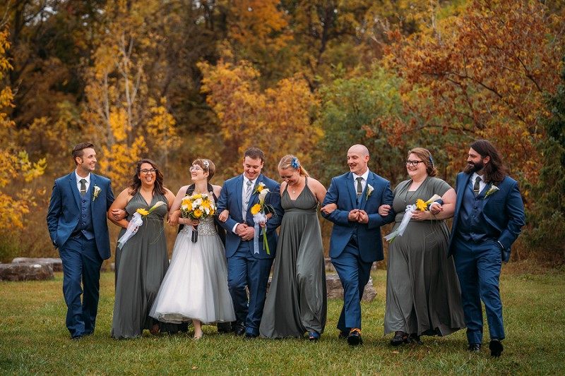 wedding party walking and laughing